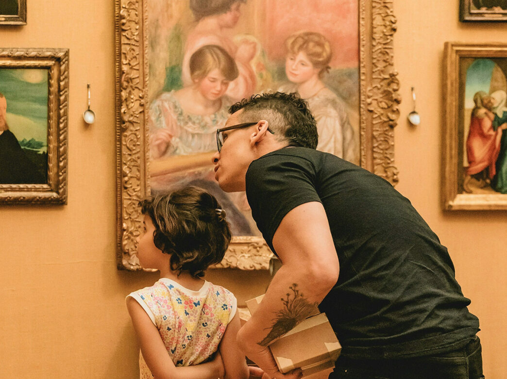An adult and child admire paintings at the Barnes Foundation during a family-friendyl event.