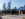 Visitors explore Calder Gardens, walking past a striking black outdoor sculpture framed by modern skyscrapers in the distance.