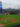 A panoramic view of the Phillies game at Citizens Bank Park showcases the vibrant green field, the towering scoreboard, and the Philadelphia skyline in the distance.