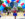 Three people in patriotic outfits in front of Independence Hall during the Red White & Blue To Do.