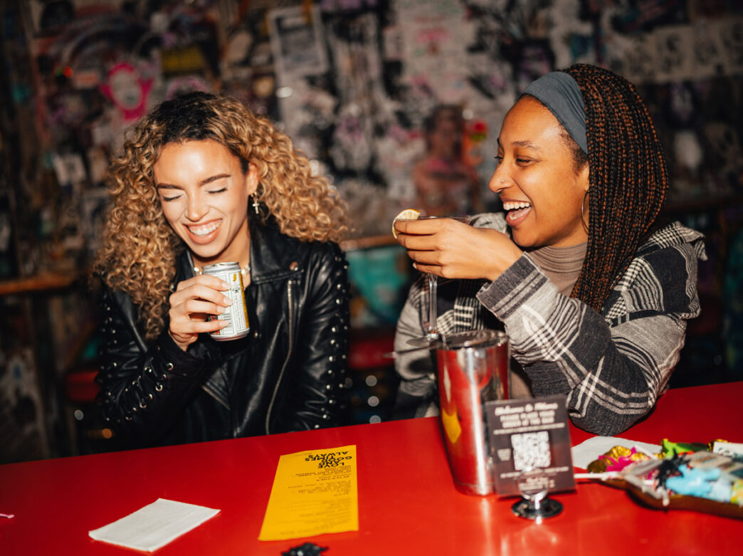Two women having drinks at Tattooed Mom